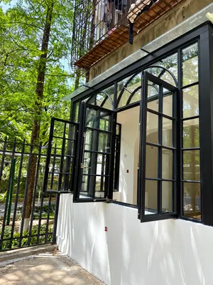 CW12 · Black — Arched-grid upper section · opening sashes