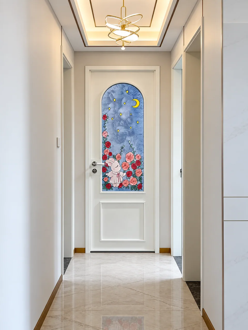 White interior door with an arched blue decorative glass panel featuring flowers and a moon