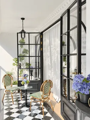RD06 · Black — Grid-glazed doors · sunroom setting